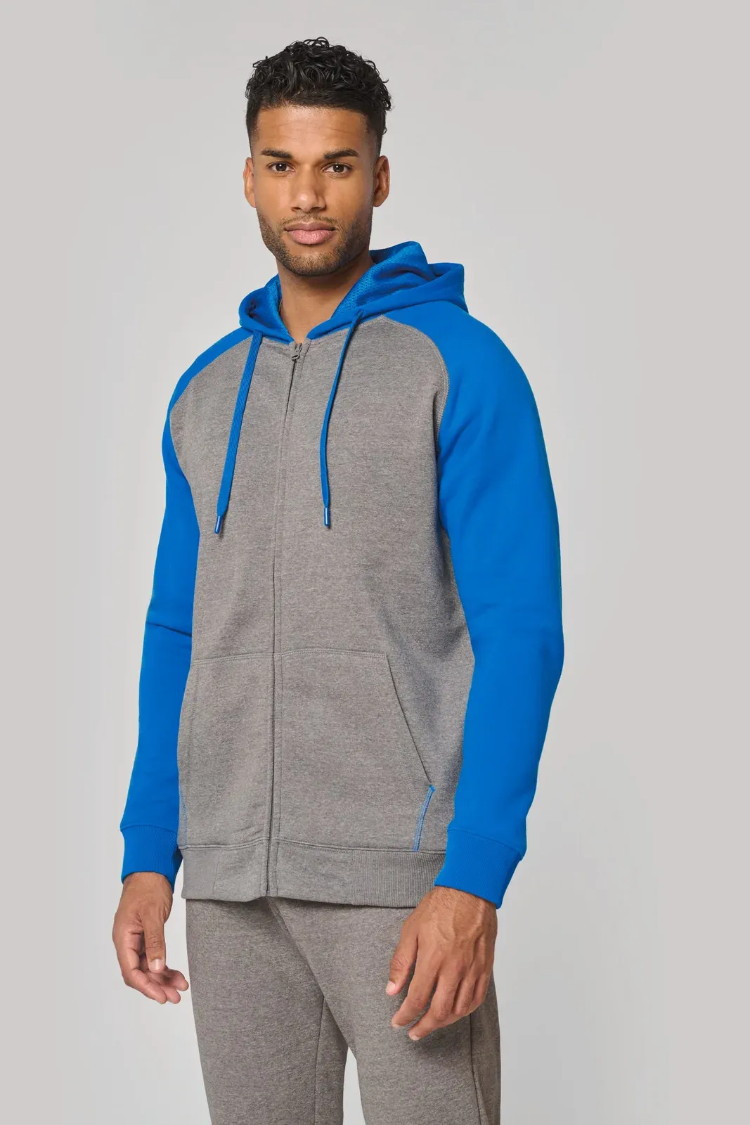 Chaqueta de felpa con cremallera y capucha bicolor unisex